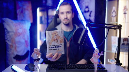 Anituber influencer reviewing Japanese manga comic in anime merchandise room