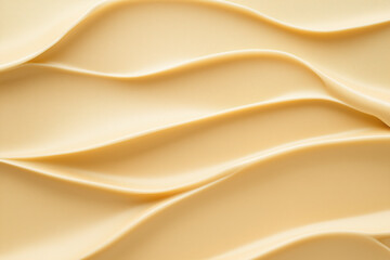 Obraz premium Smooth cream texture with elegant waves showcasing a soft beige color