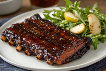 A succulent BBQ beef brisket with crispy edges, served alongside a fresh arugula and pear salad.