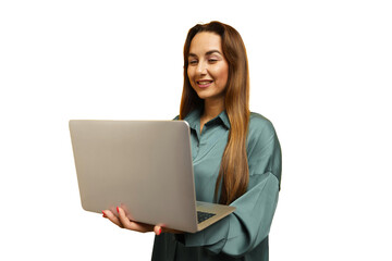 Woman with long hair smiles while using a laptop in a bright indoor setting with minimal...