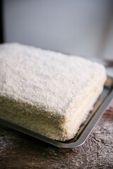Delicious white Raffaello cake with coconut flakes