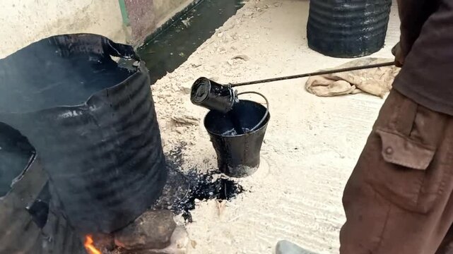 Manual Asphalt Roofing Application with Hot Tar Bucket, Sand, Fire