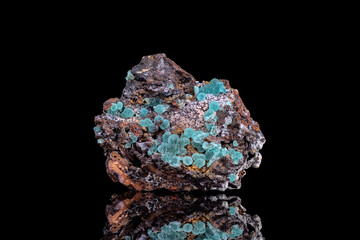 Adamite blue crystals. Specimen from Hilarion Mine, Greece. photography isolated on black background. macro detail close-up mineral crystal unpolished semi-precious gemstone.
