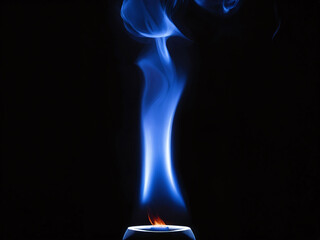 Blue flame dances quietly in dark surroundings, creating an enchanting visual effect