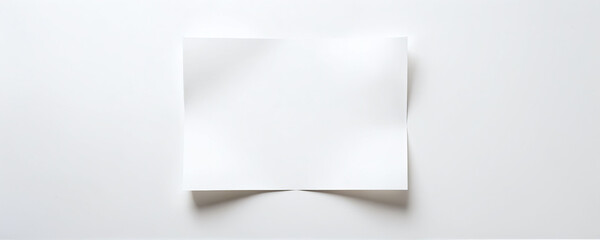 Blank white paper on a clean surface ready for notes or artwork creation in a simple workspace environment