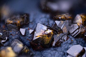 Black and yellow crystals of Corkite on oxide. Specimen from Serra da Mina Mine, Cercal, Portugal.  Micro photography extreme close-up. microscope mineral crystal photography for Scientific use.
