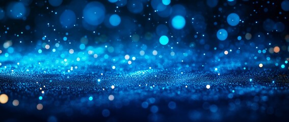 Obraz premium Glittering blue backdrop with bokeh lights