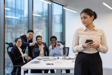 Colleagues mocking new office worker. Unethical workplace behavior, various people discussing and...