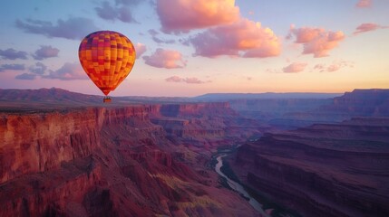 Obraz premium 121. A glowing hot air balloon drifting above an ethereal canyon at sunset