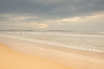 Surfing Paradise and golden beach in Weligama coast of Indian ocean in Sri Lanka. A favorite destination for travelers seeking relaxing, swimming, and enjoying the tropical vibe.