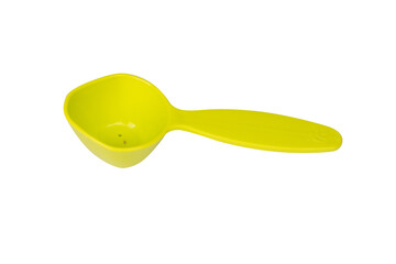 Green measuring spoon isolated on white background