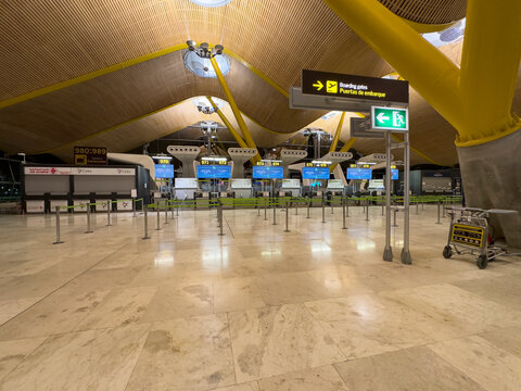 Madrid, Spain; November 7, 2024: Find your check-in counter in Madrid Airport Terminal 4 at Adolfo Suarez Barajas. This modern terminal offers efficient check-in counters for a seamless travel.
