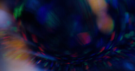 Defocused fragmented light. Festive dispersion. Refraction color flare circular center. Ray passes...