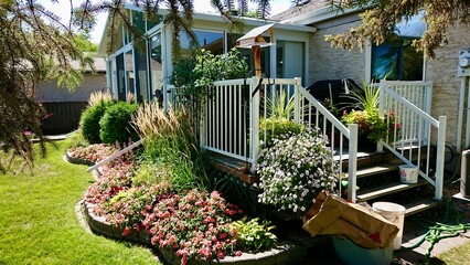 backyard of the house decorated with flowers and plants