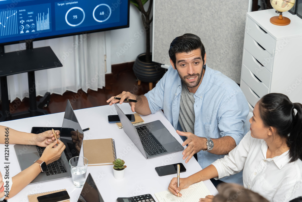 Fototapete Analyst team utilizing BI Fintech to analyze financial data at table in meeting room. Businesspeople analyzing BI dashboard power for business insight and strategic marketing planning. Prudent