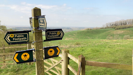Signpost indicating directions for public footpaths and the Viking Way in a rural, scenic landscape - Lincolnshire, UK