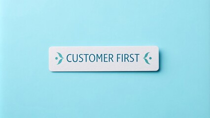 Fototapeta premium Customer First Sign on Solid Light Blue Background - A sign emphasizing customer priority, featuring a clear message, symbolic of service, care, professionalism and commitment.