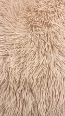 Beige Fluffy Rug Texture Close-Up, Suitable For Home Decor, Interior Design Projects, Textile Backgrounds, And Soft Furnishings Marketing Highlighting Comfort And Warmth.