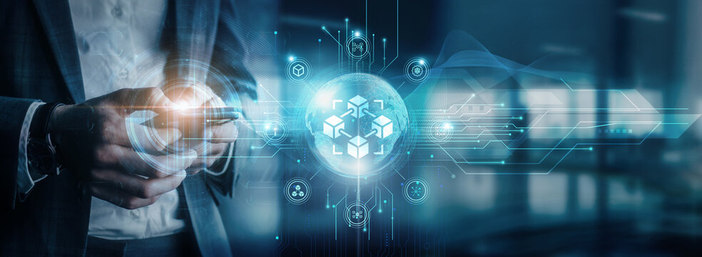 Businessman using mobile devices to interact with blockchain technology, global network connectivity, blockchain solutions, and digital transformation.