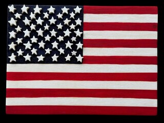 United States of America, national flag hand painted with wooden carved stars over black background