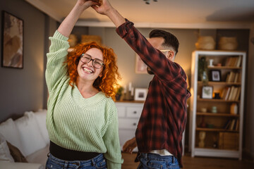 man and woman couple in love have slowly romantic dance at home