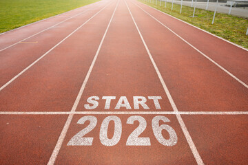 Start of new year. Changes of year 2025, 2026, 2027 on Running track. Concept of new ideas starting in new year, planning along with setting objectives to set KPI goals for success in life.