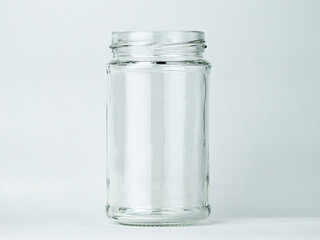 Clear glass jar on a plain background