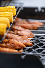 Chicken skewers on a barbecue.