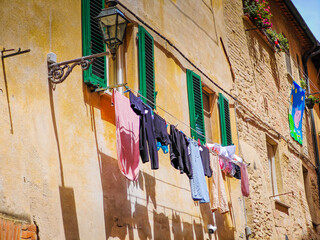 Volterra, Tuscany. Street view of Volterra with laundry outside the window - medieval Tuscan town located on a hill with old town