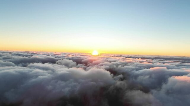 Pico do Arieiro and golden hour, aerial view of sunrise above the clouds in Madeira