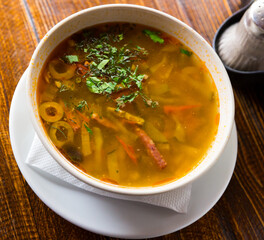 Russian cuisine - solyanka soup with various ingredients. High quality photo