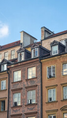 Warsaw, Poland - July 26 2023 Facade of restored medieval building around Stary Rynek, Old Town Market Place. The urban complex is almost entirely reconstructed after the WWII total destruction.