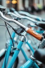Obraz premium A row of blue bicycles parked next to each other on a paved path