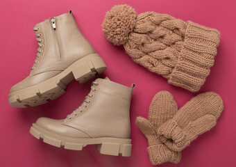 Winter accessories on color background, top view