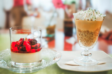 Lemon pie and panna cotta dessert cups waiting on table