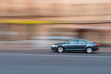 Obraz premium fotografía en movimiento fondo desenfocado coche
