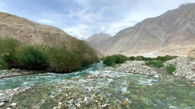 Shyok River near Rongdu Village and the Himalayan mountains of Nubra Valley in the morning, north of Leh, Ladakh, Jammu and Kashmir, India.