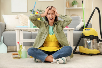 Worried housewife during cleaning at home
