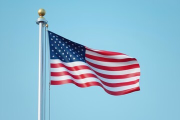 Fototapeta premium The American Flag Unfurling in a Clear Blue Sky