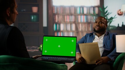 Diverse secret agents discussing next to isolated chroma key on screen, meeting in the CIA headquarters library to discuss important mission details. Secure information for national safety. Camera A.