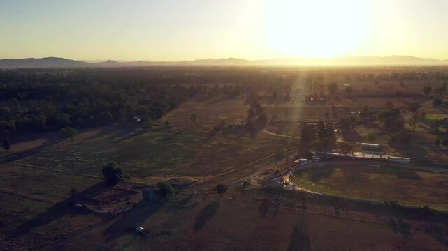 Rising sun over local farms and race course in Gunnedah town of Australia &ndash; aerial 4k.
