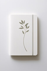 White botanical themed notebook with watercolor illustrations on a smooth white background ideal for any desk