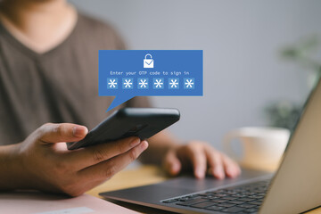 Man entering OTP code on smartphone for two factor authentication, enhancing security for online...