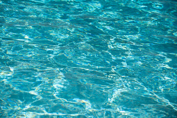 Pool water background, blue wave abstract or rippled water texture background.