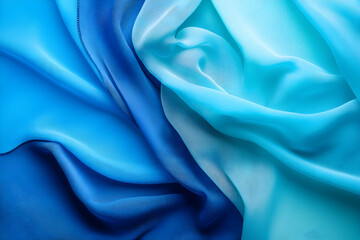Obraz premium Abstract image of flowing blue and turquoise fabric, showcasing texture and color gradient. Ideal for design projects and backgrounds.