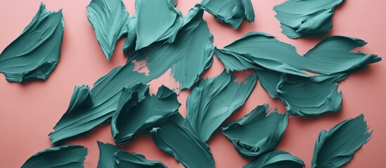 Teal paint strokes on pink background.