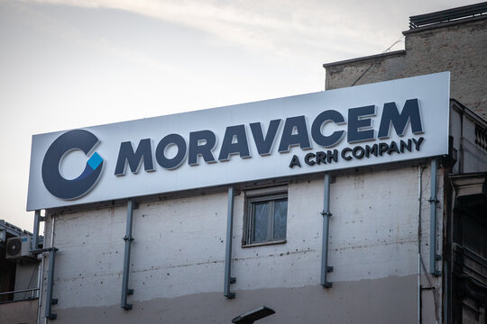BELGRADE, SERBIA - OCTOBER 12, 2024: The Moravacem signage, a CRH company brand, displayed on an office building. Moravacem is a concrete factory and asphalt producer in Serbia.