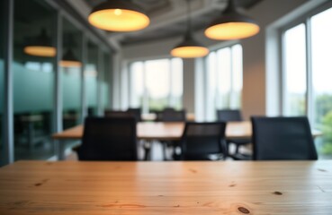 Blurred modern office space with wooden table, chairs. Interior design. Empty room. Natural light. Business background. Corporate style. Empty meeting room. Suitable for presentation design project.