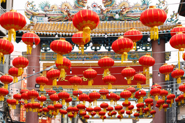 Lunar or Chinese new year lanterns decorated around temple, Thailand.