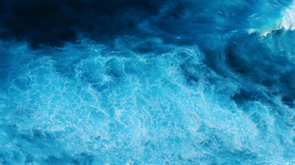 Obraz premium Seascape dark ocean background wave splash on rock. Tropical sea beach in summer seaside outdoor. Water Surface blue wave pattern. Turquoise ocean sea water white wave pattern splashing deep blue sea